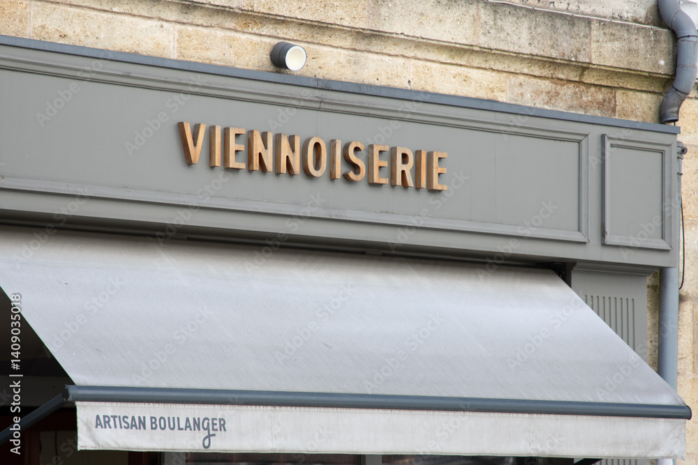 viennoiserie text french and sign on shop facade means pastry entrance pastries boutique in france