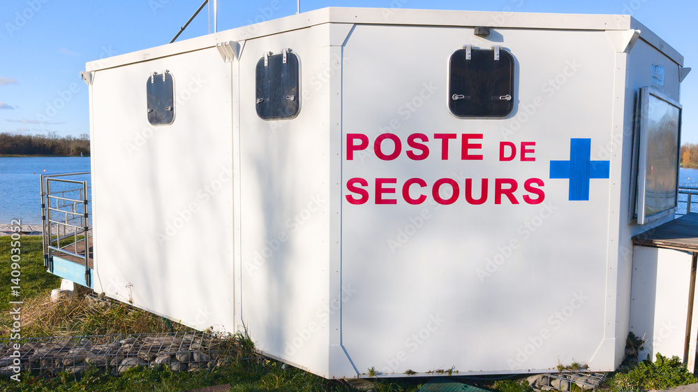 poste de secours accueil french text means prefabricated modular first aid station placed on the sand of the lake beach to rescue swimmers on door facade entrance cabin hut lifeguard