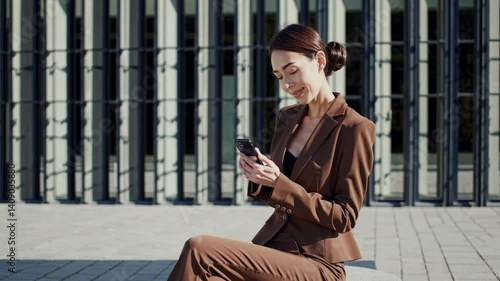 The Woman with Smartphone Outdoors