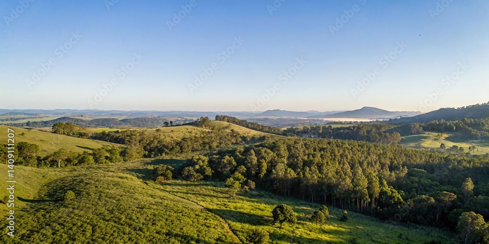 Obraz premium Serene Green Hills Landscape Sunrise View