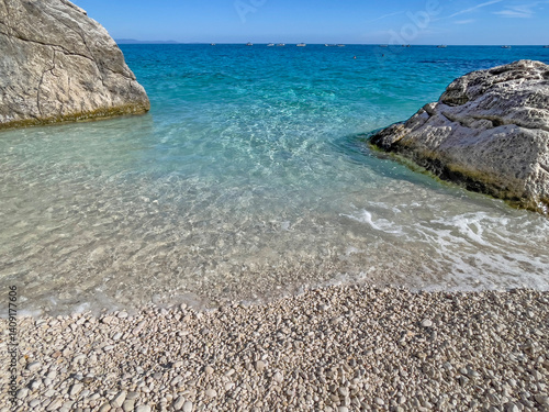 beautiful beach of cala Goloritze in Sardinia-Italy, with turquoise sea betwe...