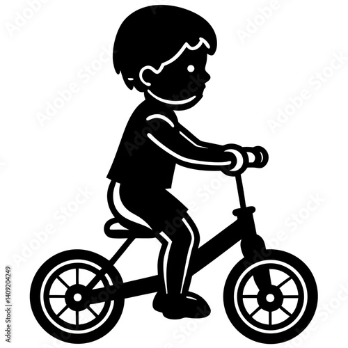 Silhouette of a child on a small bicycle with training wheels 