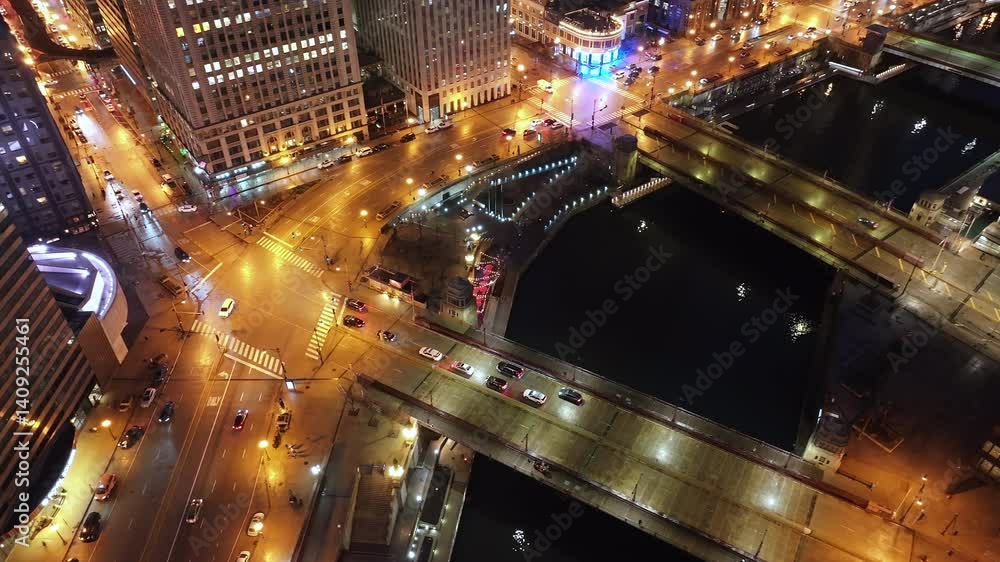 Aerial view of the Chicago Loop at night. Shot along the Chicago River. Aerial view of the Chicago Loop at night. Shot along the Chicago River.