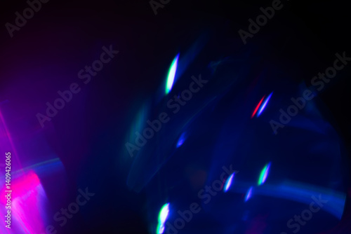 Blurred Light painting one exposure in camera. light glares with a spectral gradient on a dark background.