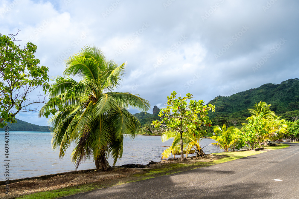 Maroe Bay with lush hills and calm waters in Huahine, French Polynesia