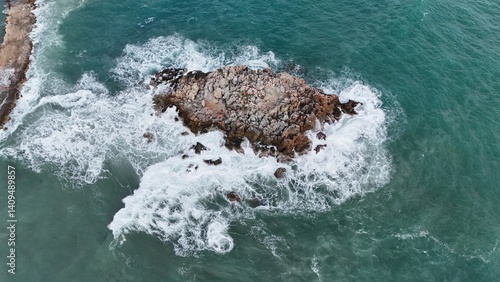 Rocky ocean waves. a small rocky island in the sea. High quality 4k footage