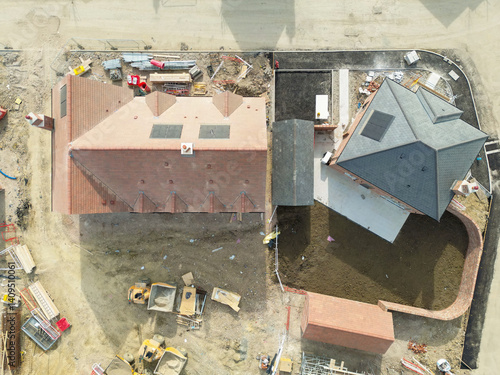 Obraz na płótnie Drone top down view of near completed semi detached and a large corner plot, detached home in rural Britain. Topsoil has been laid to the larger house rear garden. w salonie