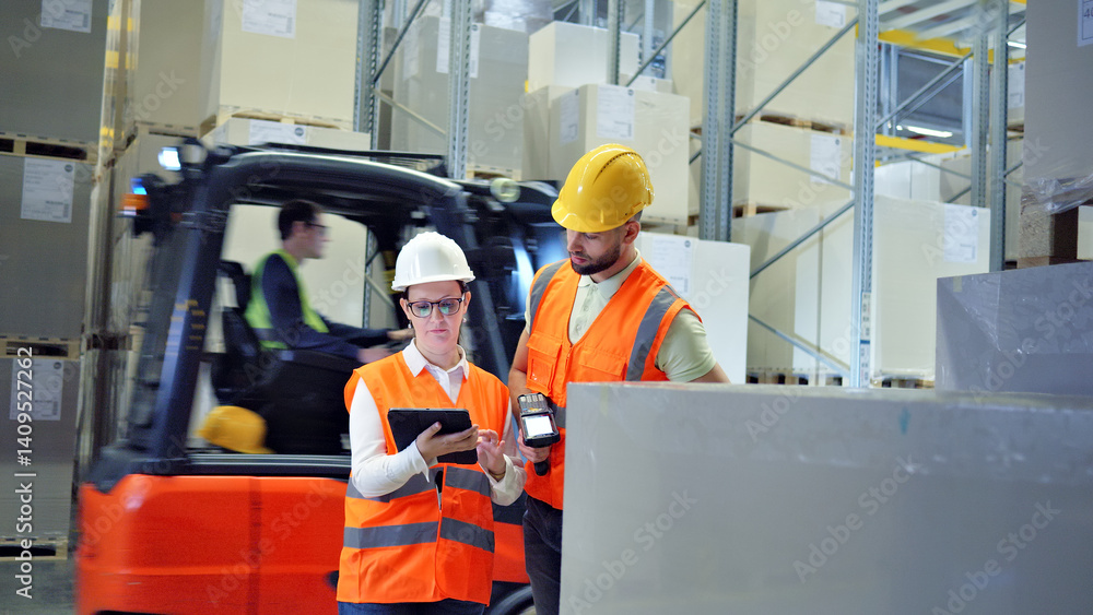In a bustling warehouse, two workers in orange vests and hard hats collaborate, symbolizing efficient global supply chain logistics. A forklift driver assists, highlighting teamwork and coordination. In a bustling warehouse, two workers in orange vests and hard hats collaborate, symbolizing efficient global supply chain logistics. A forklift driver assists, highlighting teamwork and coordination.