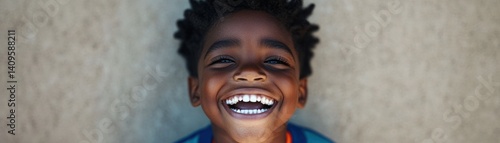 Obraz na płótnie Joyful young boy with curly hair smiling brightly with happiness on a sunny day, showcasing pure innocence and joyful spirit in a vibrant outdoor setting w salonie