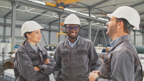 Canvas Print Three multiethnic people speaking with each other before working in workshop