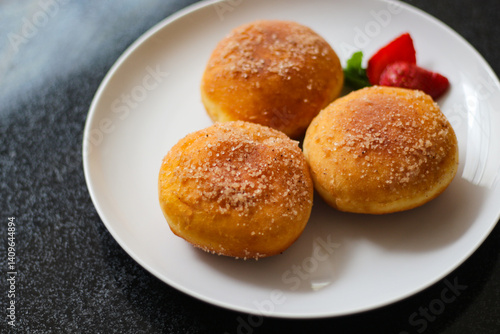 Wallpaper Mural A handmade bombolone or bomboloni is an Italian-filled doughnut that is eaten as a snack or dessert. Selective focus. Torontodigital.ca