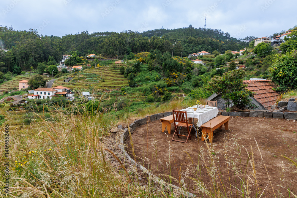 Table for outdoor dinner in Camacha mountainous town in municipality of Santa Cruz, Madeira Island, Portugal