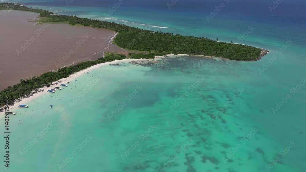 Aerial view of Saona Island, turquoise waters, white sand, boats and a pure tropical paradise in the Dominican Republic. Aerial view of Saona Island, turquoise waters, white sand, boats and a pure tropical paradise in the Dominican Republic.