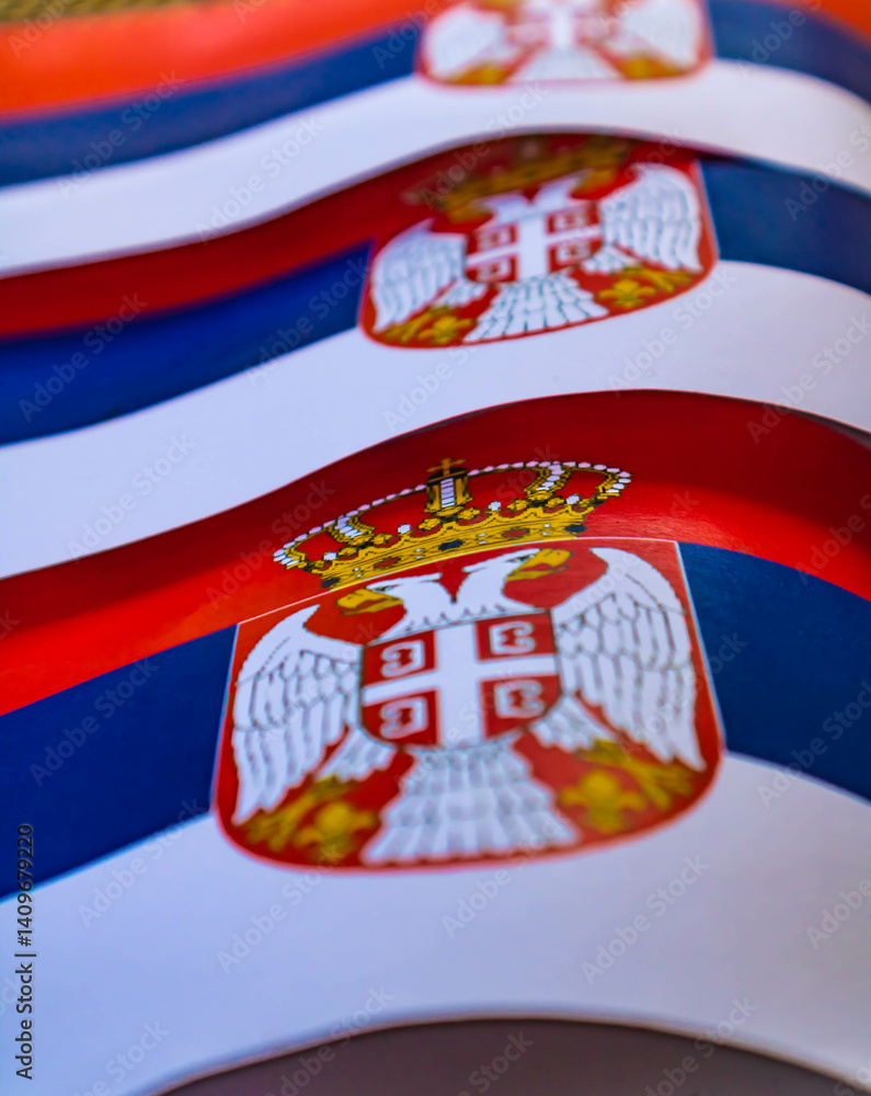 Obraz premium Close up of Serbian flags with the coat of arms