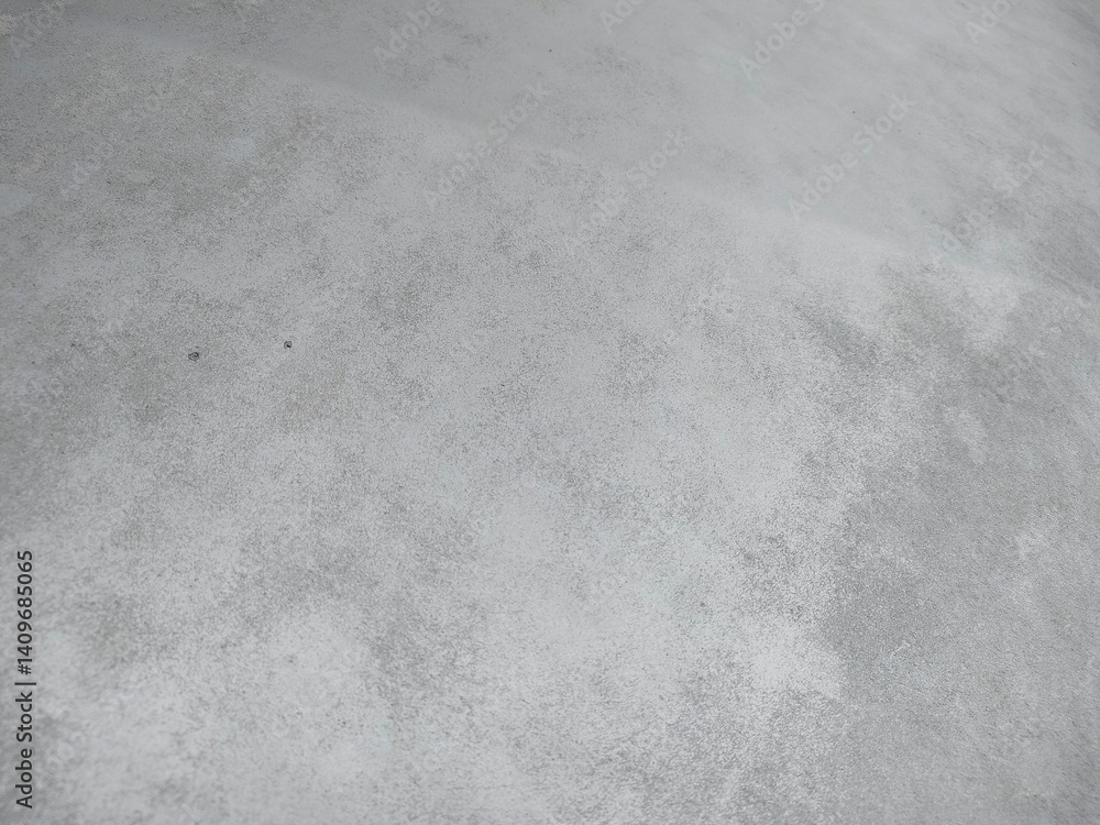 Fototapeta premium Neutral light grey carpet texture. Soft, uniform surface. Ideal for backgrounds and design elements