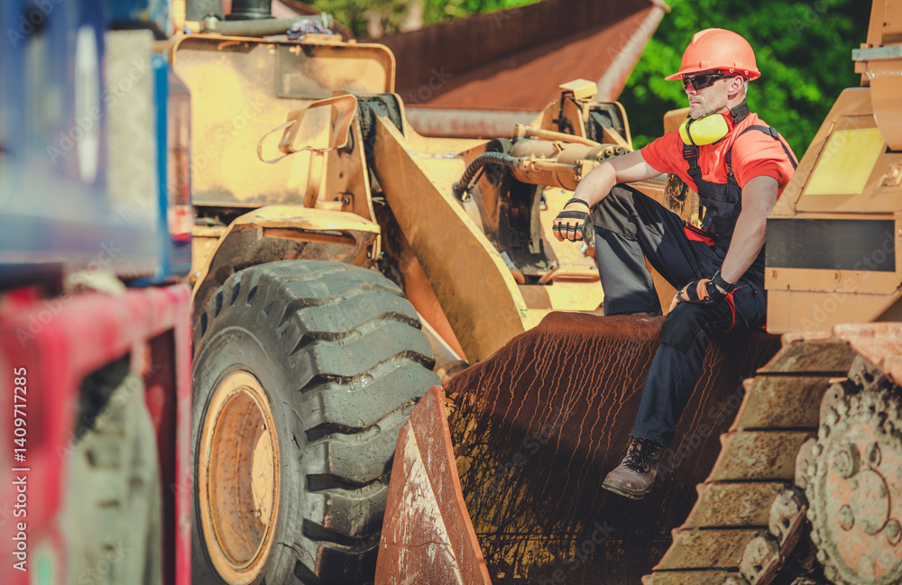 Construction Worker Resting on Heavy Machinery During Work Hours