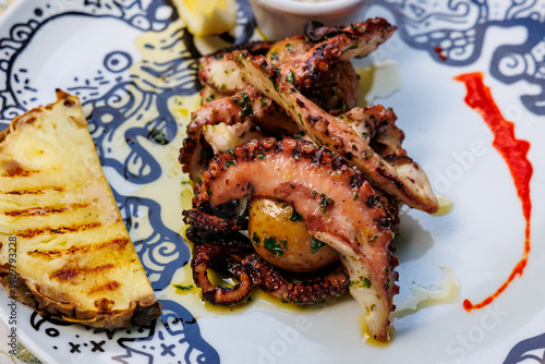 Obraz na płótnie Grilled octopus in restaurant in Funchal city, capital of Madeira Island, Portugal w salonie