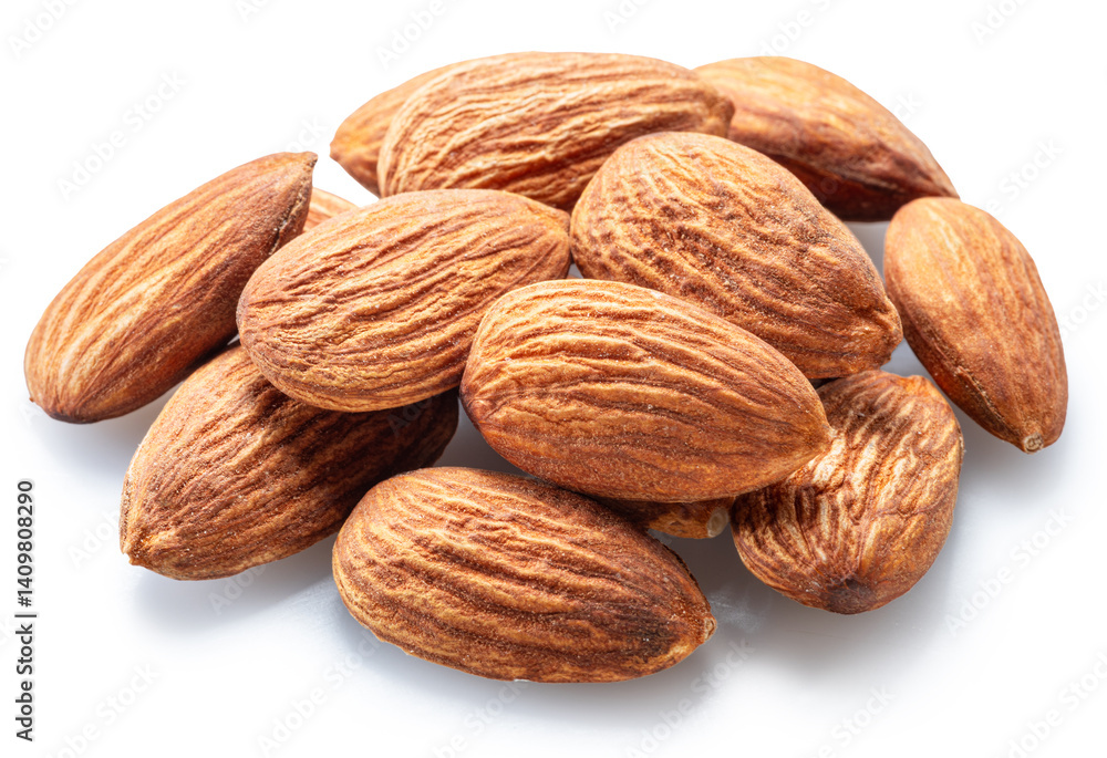 Pile of shelled almond nuts isolated on white background. File contains clipping path. Pile of shelled almond nuts isolated on white background. File contains clipping path.