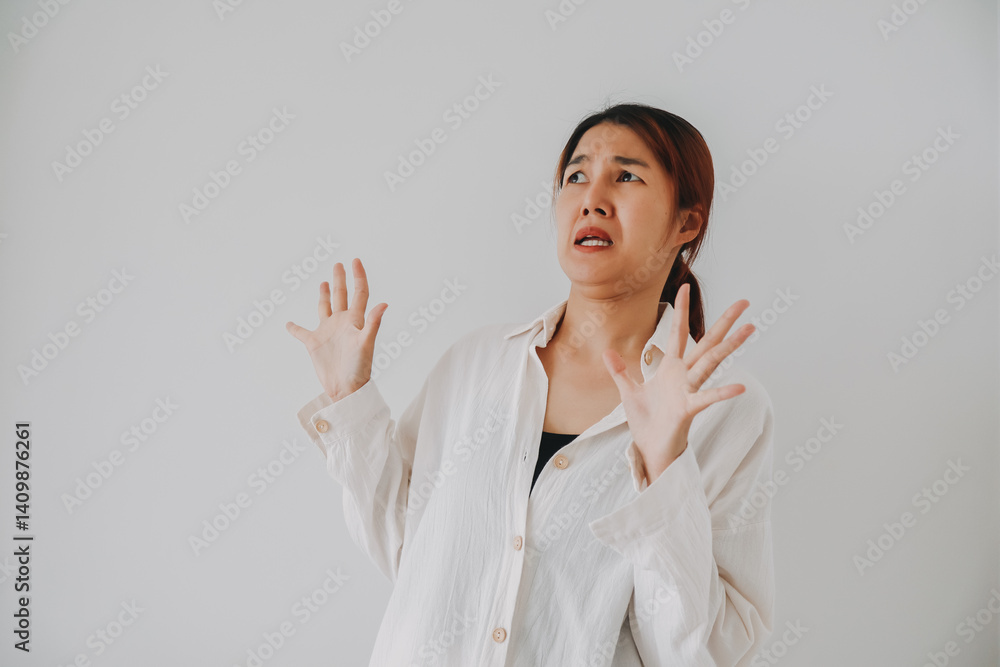 Shocked funny face of Asian Thai woman, spreading hands, surprised with bad things, dislike, unbelievable, standing over white background wall. Shocked funny face of Asian Thai woman, spreading hands, surprised with bad things, dislike, unbelievable, standing over white background wall.