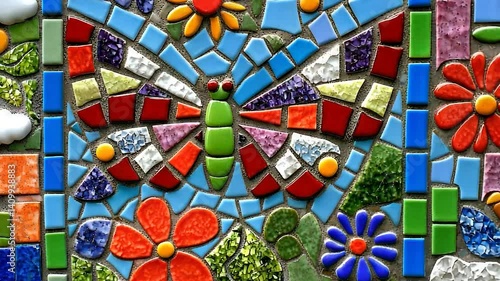 Colorful mosaic butterfly amidst flowers