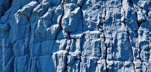 Obraz na płótnie Steep cliff face of textured blue rocks, natural light, earth, wall, mountain w salonie
