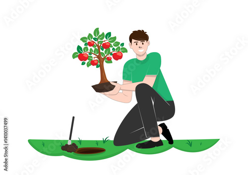 Young man planting an apple tree In the garden area of his house
