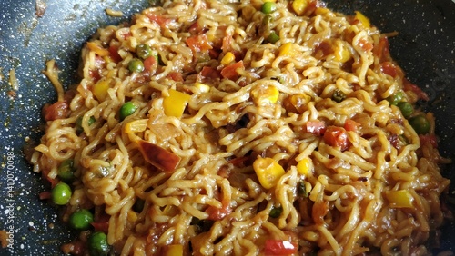 A mixed vegetable Maggi noodle platter, a popular snack meal throughout India.Butter maggi Noodles
