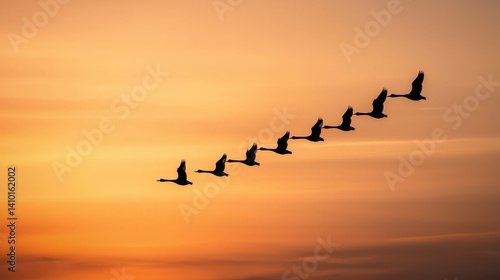 Wallpaper Mural Silhouetted birds fly in a V-formation against a vibrant sunset, showcasing the beauty of nature and migration. Torontodigital.ca