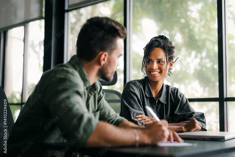 A diverse, talented team collaborates effectively in a bright office space during a business meeting