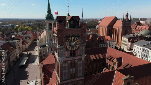 Aerial view on sunny day of historical tourist center of medieval city Torun, old town, churches, cathedrals and Vistula river, Poland, Europe