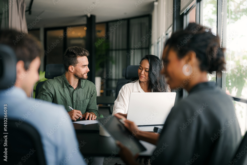 A diverse, talented team collaborates effectively in a bright office space during a business meeting
