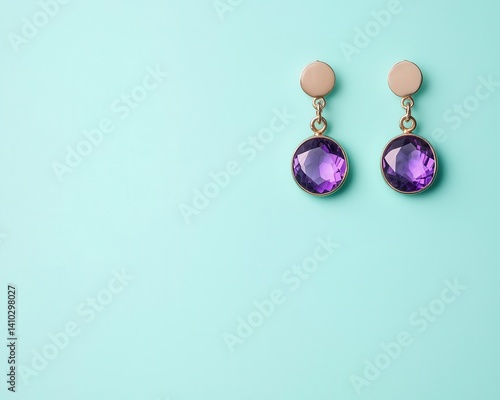 Statement drop earrings with cascading chain links and a central amethyst, isolated on a pastel teal background