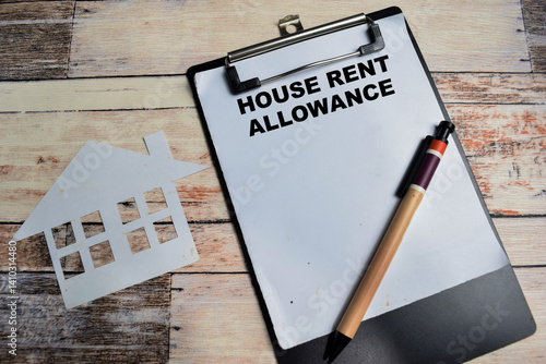 Schilderij op canvas Concept of House Rent Allowance write on paperwork isolated on Wooden Table