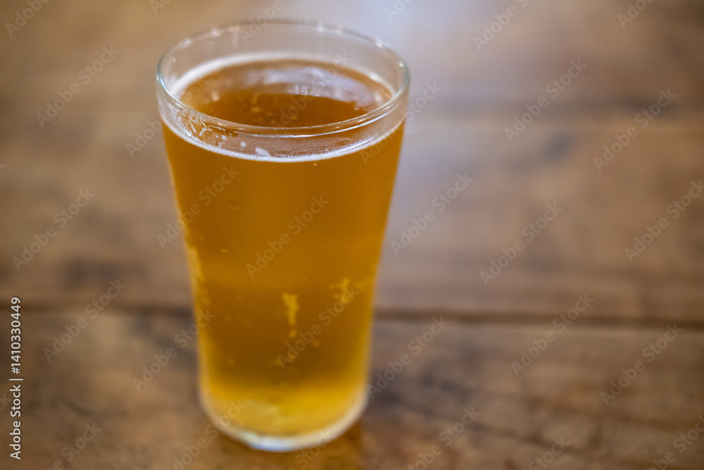 Glass of beer on the wooden table Glass of beer on the wooden table