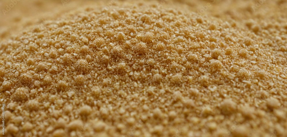 An awe-inspiring close-up view of sand grains magnified under a microscope, revealing an intricate tapestry of delicate textures and patterns.