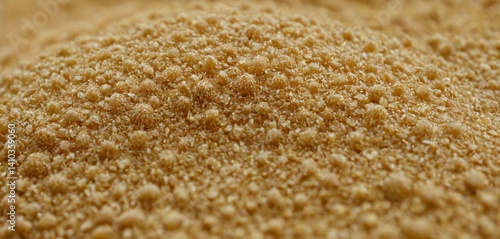 Obraz na płótnie An awe-inspiring close-up view of sand grains magnified under a microscope, revealing an intricate tapestry of delicate textures and patterns. w salonie