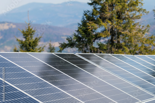 Obraz na płótnie Photovoltaic panels against the backdrop of a mountain landscape. Solar panels high in the mountains at a mountain shelter w salonie
