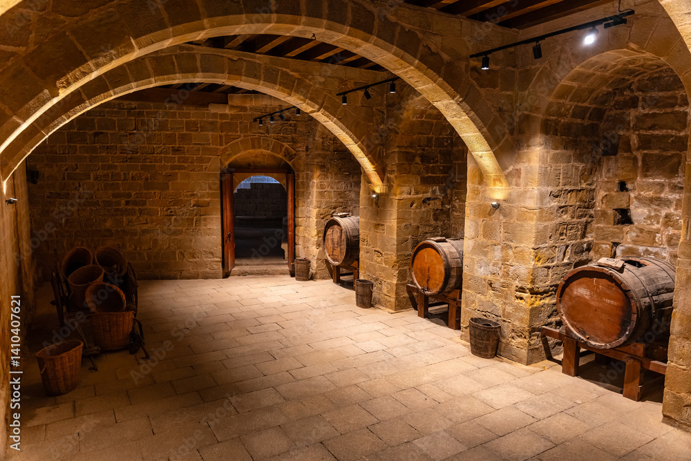 Very old cellars in storage with stone arches and old wooden vats. Teruel, Spain.