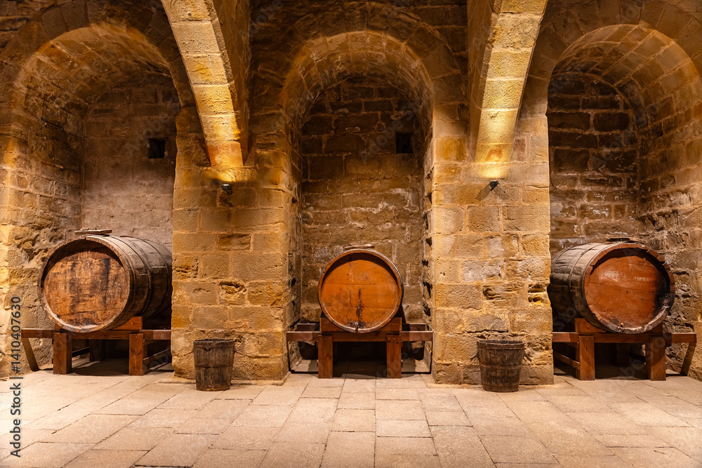 Very old cellars in storage with stone arches and old wooden vats. Teruel, Spain.
