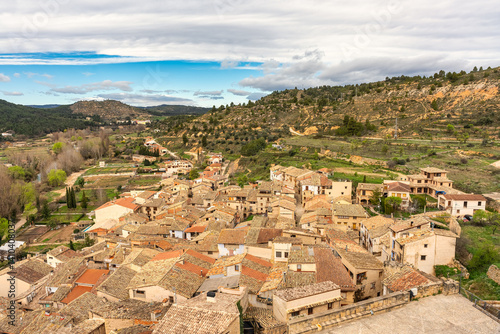 Old roofs in the medieval houses of the village of Valderrobres next to the mountain, Aragon.