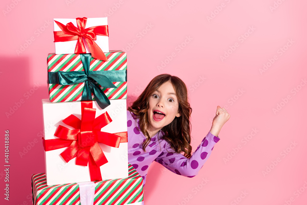Excited Young Girl Celebrates with a Stack of Holiday Presents in a Cheerful and Festive Setting Featuring a Vibrant Pink Background Excited Young Girl Celebrates with a Stack of Holiday Presents in a Cheerful and Festive Setting Featuring a Vibrant Pink Background