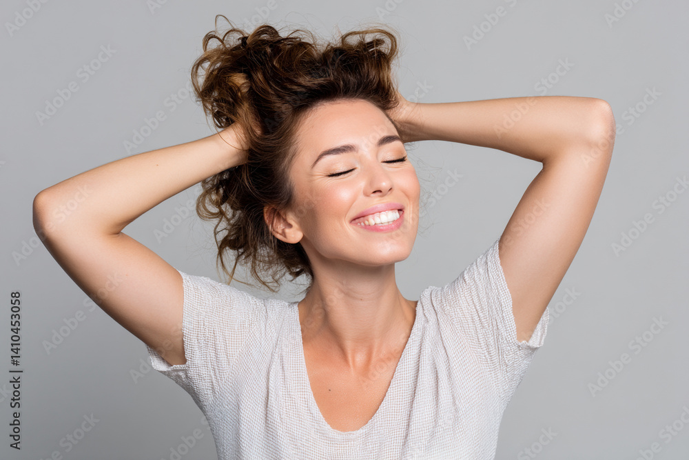 Studio shot of a happy caucasian woman adjusting her hair with closed eyes Studio shot of a happy caucasian woman adjusting her hair with closed eyes
