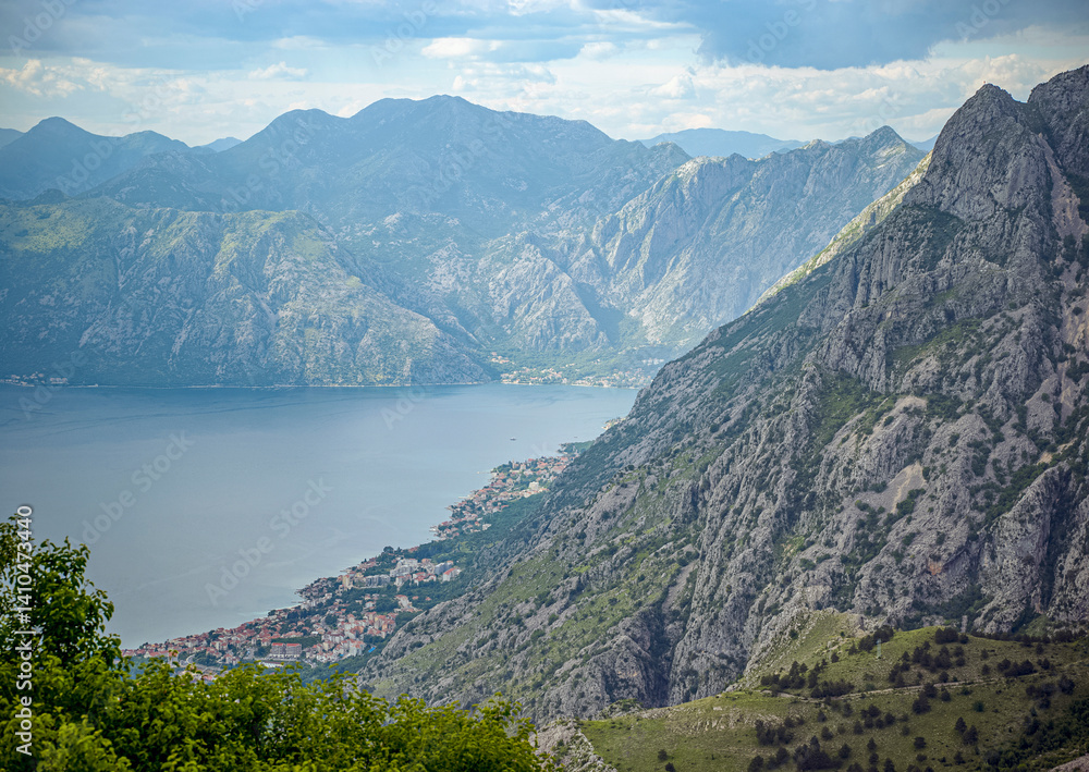 Fototapeta premium Kotor Bay, Montenegro, Mountains meet the sea, dotted with towns and trees