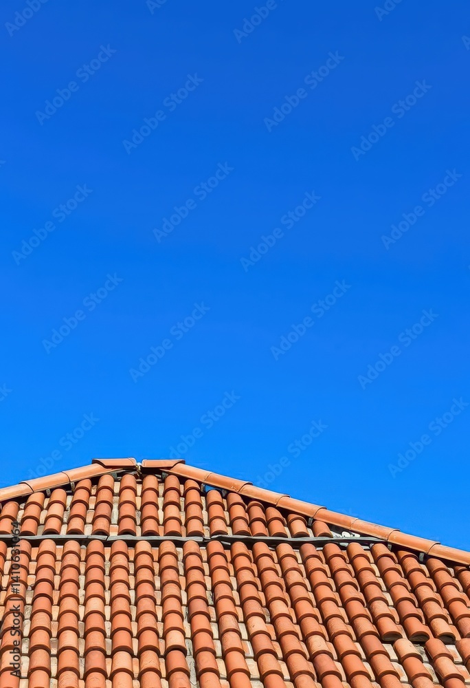 Rustic clay-tiled church roof against vibrant blue sky, vintage, tiles, hope Rustic clay-tiled church roof against vibrant blue sky, vintage, tiles, hope