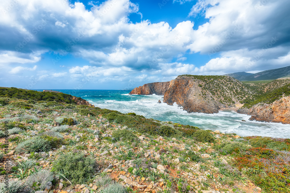 Unbelivable view of cliffs in valley Cala Domestica and storm on the sea