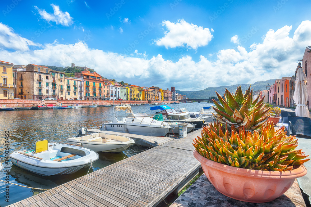 Attractive cityscape of Bosa town with Ponte Vecchio bridge across the Temo river.