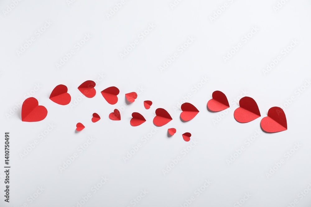 Many paper hearts on light grey background, flat lay Many paper hearts on light grey background, flat lay
