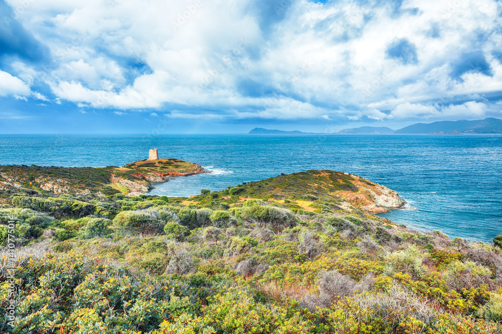 Attractive morning view of Piscinni bay with turquoise sea and famous coastal tower of Piscinni.