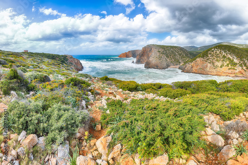 Obraz na płótnie Unbelivable view of cliffs in valley Cala Domestica and storm on the sea w salonie
