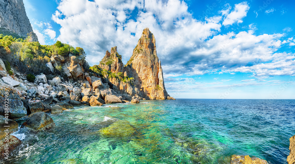 Exciting view of Punta Pedra Longa and azure water in sea.